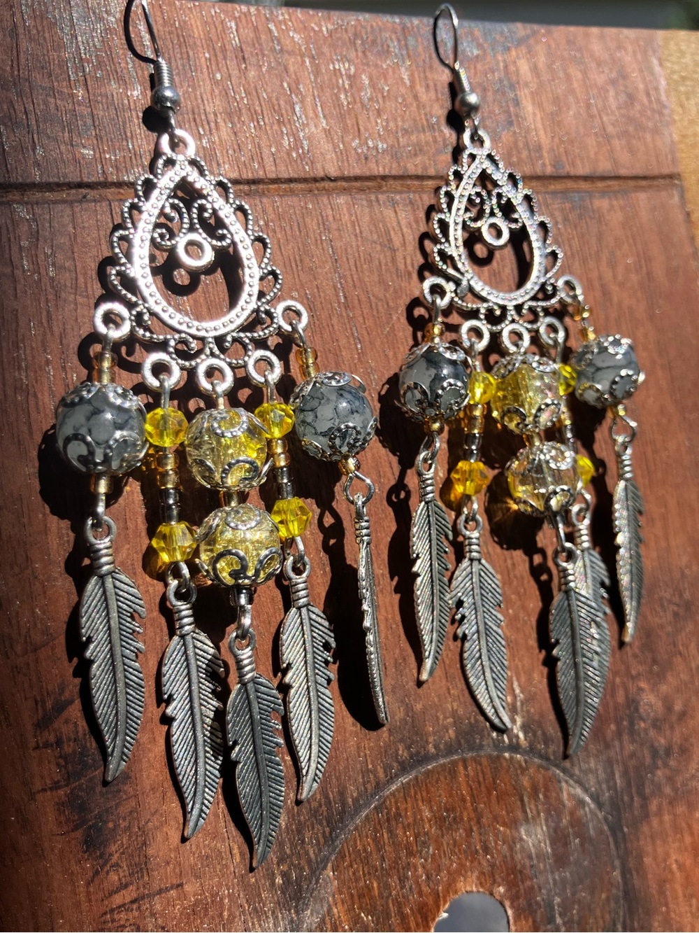 Yellow and grey dream catcher dangle earrings with silver accent and glass beads